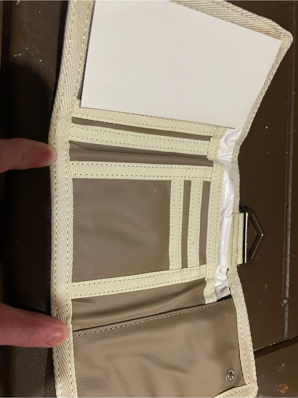 Calvin Klein Brown Tri-Fold Wallet with Cream Trim.